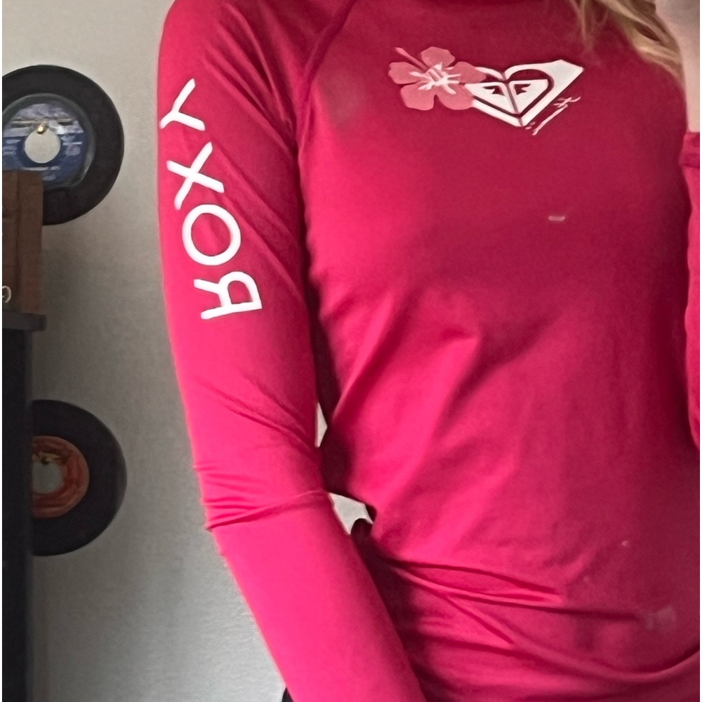 Pink rash guard for surfing, body boarding, etc.
